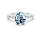 White gold Oval Cut Aquamarine Solitaire Engagement Ring with Pavé Band and Four-Prong Setting