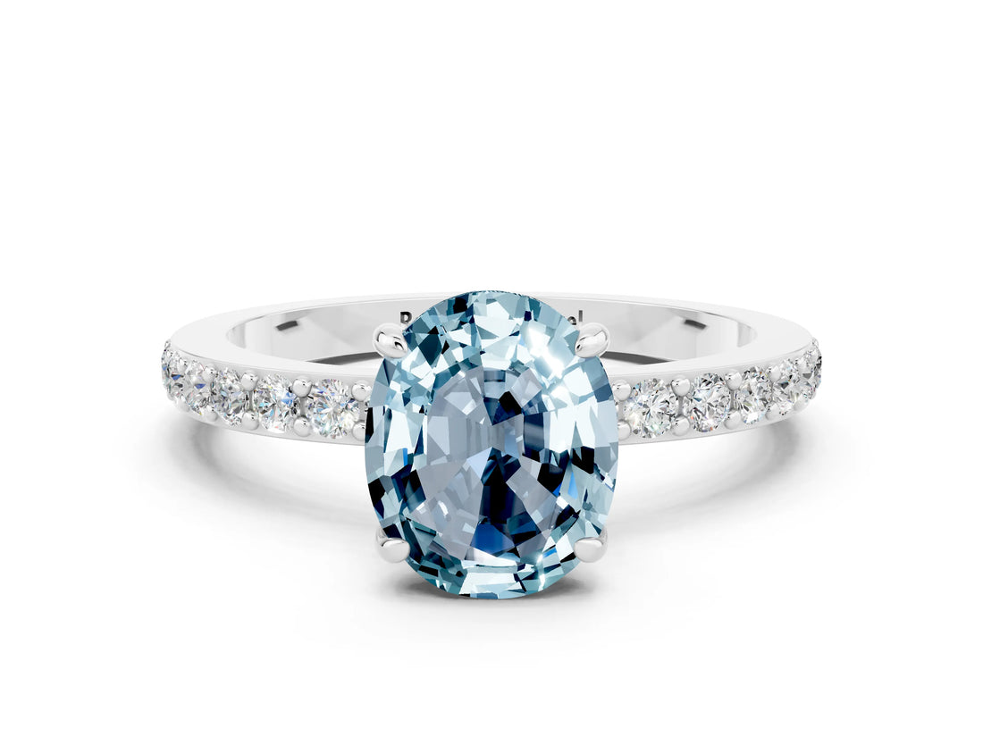 White gold Oval Cut Aquamarine Solitaire Engagement Ring with Pavé Band and Four-Prong Setting