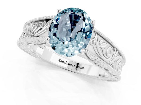 Platinum Oval Cut Aquamarine Solitaire Ring with Engraved Band and Four-Prong Setting