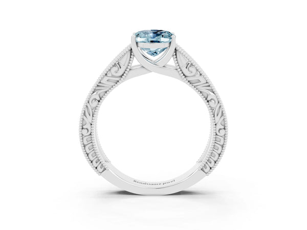 Platinum Oval Cut Aquamarine Solitaire Ring with Engraved Band and Four-Prong Setting