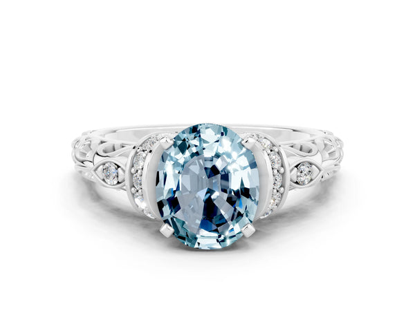 White gold Oval Cut Aquamarine Solitaire Ring with Filigree Band and Four-Prong Setting