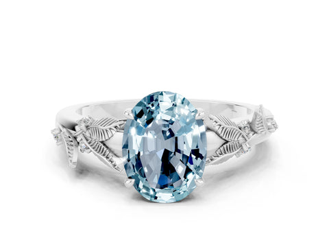 White gold Oval Cut Aquamarine Solitaire Ring with Leaf Motif Band and Four-Prong Setting