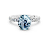 White gold Oval Cut Aquamarine Solitaire Ring with Pavé Accents and Four-Prong Setting