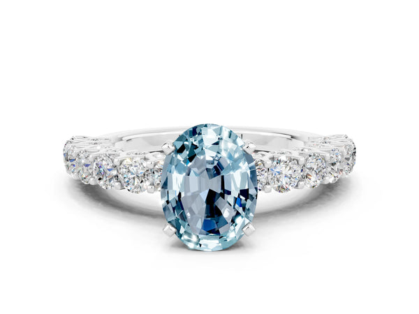Platinum Oval Cut Aquamarine Solitaire Ring with Shared Prong Pavé Band and Four-Prong Setting