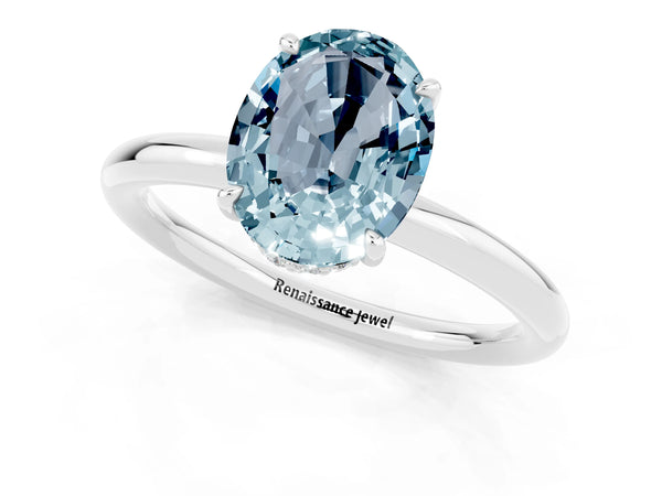 Silver Oval Cut Aquamarine Solitaire Ring with Thin Band and Four-Prong Setting