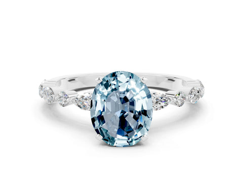 White gold Oval Cut Aquamarine Solitaire with Side Stones on a Pavé Band and Four-Prong Setting