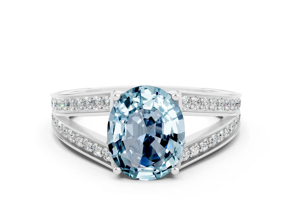 White gold Oval Cut Aquamarine Split Shank Ring with Pavé Band and Four-Prong Setting