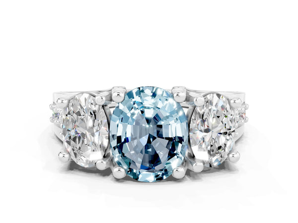 Platinum Oval Cut Aquamarine Three-Stone Ring with Channel Set Band and Four-Prong Setting