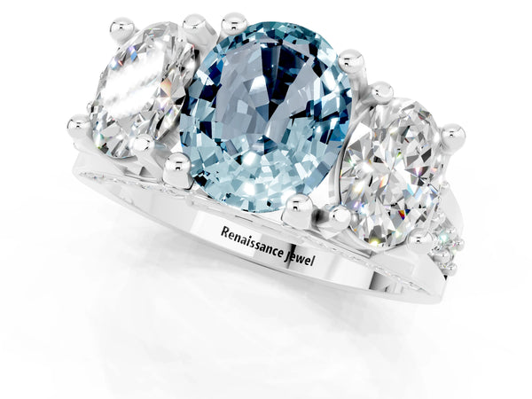 Silver Oval Cut Aquamarine Three-Stone Ring with Channel Set Band and Four-Prong Setting