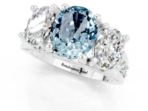 White gold Oval Cut Aquamarine Three-Stone Ring with Channel Set Band and Four-Prong Setting_1