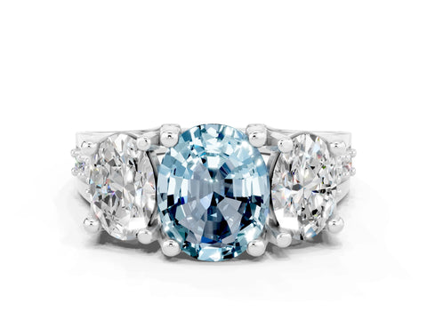 White gold Oval Cut Aquamarine Three-Stone Ring with Channel Set Band and Four-Prong Setting
