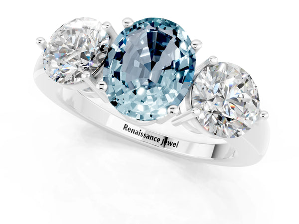 Platinum Oval Cut Aquamarine Three-Stone Ring with Prong Setting and Classic Band