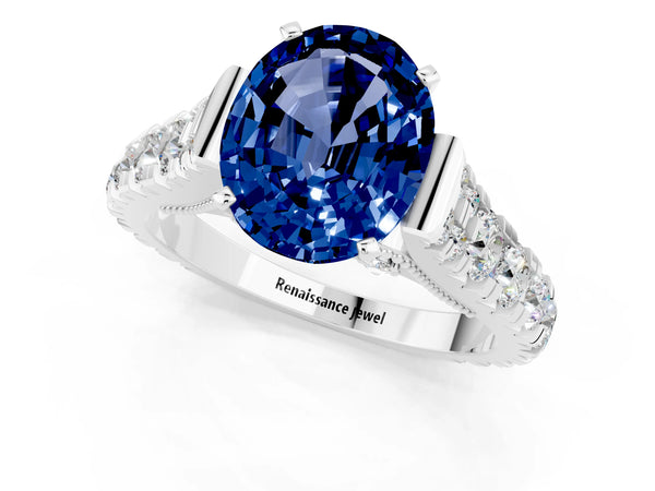 White gold Oval Cut Blue Sapphire Classic Solitaire Ring with Pavé Band and Four-Prong Setting