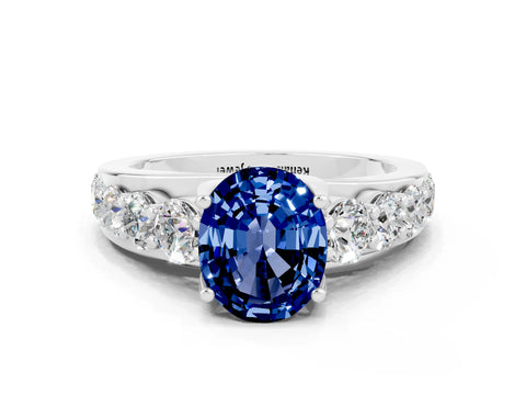 White gold Oval Cut Blue Sapphire Engagement Ring with Pavé Band and Four-Prong Setting