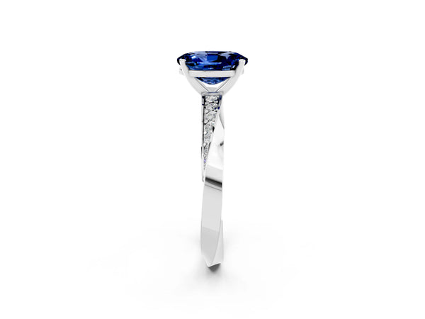 White gold Oval Cut Blue Sapphire Engagement Ring with Side Stone Accents and Four-Prong Setting