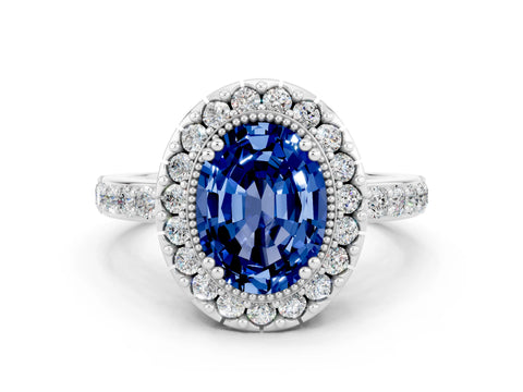 White gold Oval Cut Blue Sapphire Halo Ring with Pavé Band and Prong Setting