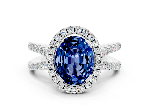 White gold Oval Cut Blue Sapphire Halo Ring with Split Shank Pavé Band and Prong Setting