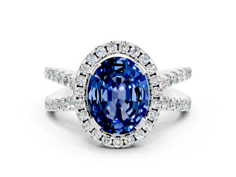 White gold Oval Cut Blue Sapphire Halo Ring with Split Shank Pavé Band and Prong Setting