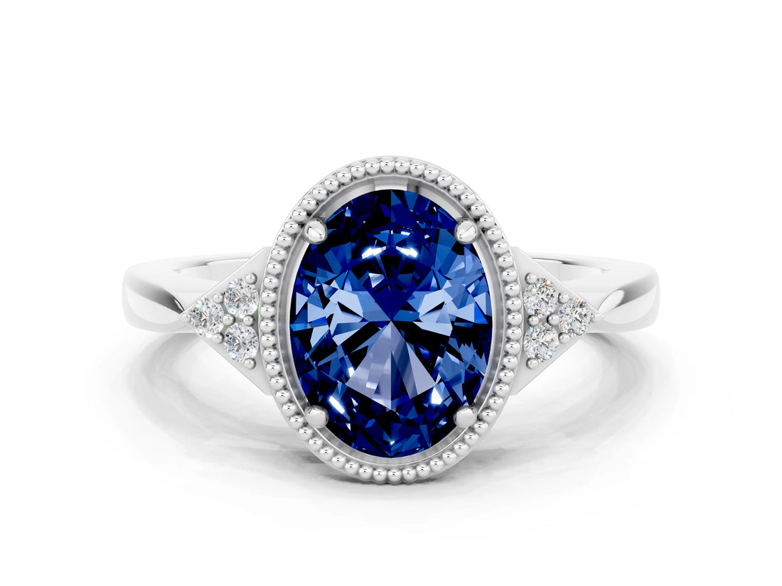 White gold Oval Cut Blue Sapphire Halo Ring with Tapered Band and Four-Prong Setting