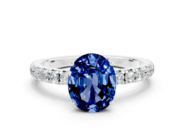 Platinum Oval Cut Blue Sapphire Pavé Solitaire Engagement Ring with Four-Prong Setting