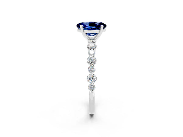 Platinum Oval Cut Blue Sapphire Prong Set Engagement Ring with Pavé Band