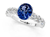 White gold Oval Cut Blue Sapphire Prong Setting with Side Stones on a Pave Band_1