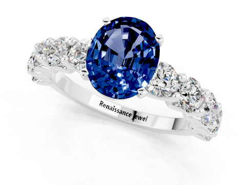 White gold Oval Cut Blue Sapphire Prong Setting with Side Stones on a Pave Band_1