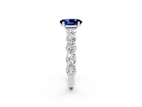 White gold Oval Cut Blue Sapphire Prong Setting with Side Stones on a Pave Band_2