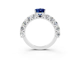 White gold Oval Cut Blue Sapphire Prong Setting with Side Stones on a Pave Band_3