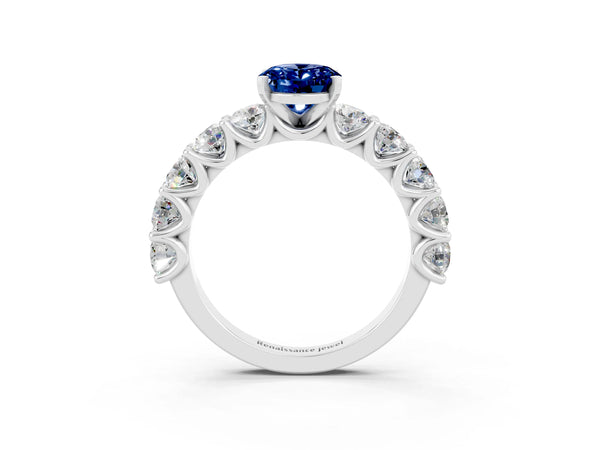 Silver Oval Cut Blue Sapphire Prong Setting with Side Stones on a Pave Band