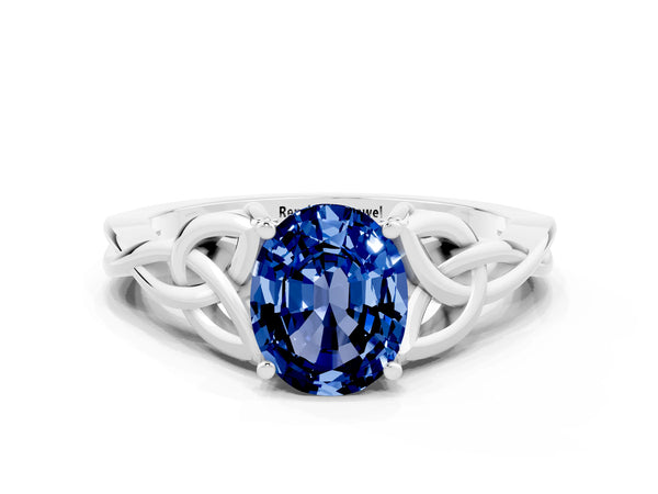 Silver Oval Cut Blue Sapphire Solitaire Celtic Knot Ring with Four-Prong Setting