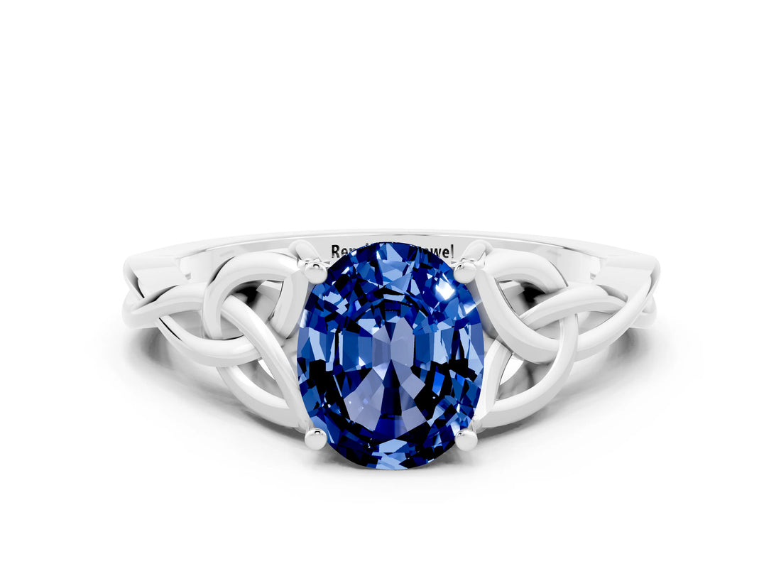 White gold Oval Cut Blue Sapphire Solitaire Engagement Ring with Celtic Knot Band and Four-Prong Setting