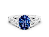 White gold Oval Cut Blue Sapphire Solitaire Engagement Ring with Celtic Knot Band and Four-Prong Setting