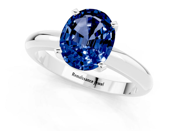 Platinum Oval Cut Blue Sapphire Solitaire Engagement Ring with Round Band and Four-Prong Setting