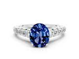 White gold Oval Cut Blue Sapphire Solitaire Ring with Cathedral Setting and Pavé Band