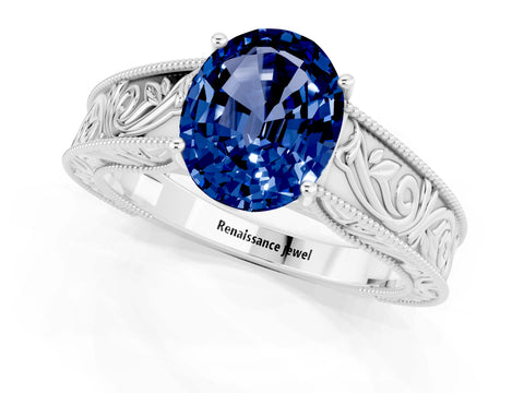 White gold Oval Cut Blue Sapphire Solitaire Ring with Engraved Band and Four-Prong Setting_1