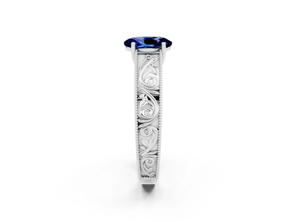 Silver Oval Cut Blue Sapphire Solitaire Ring with Engraved Band and Four-Prong Setting