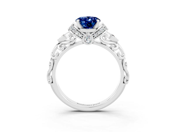 Platinum Oval Cut Blue Sapphire Solitaire Ring with Filigree Band and Four-Prong Setting