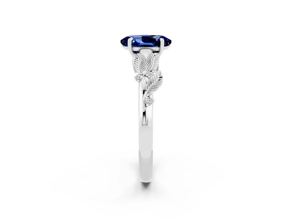 White gold Oval Cut Blue Sapphire Solitaire Ring with Leaf Motif Band and Four-Prong Setting