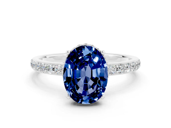 Platinum Oval Cut Blue Sapphire Solitaire Ring with Pavé Band and Hidden Halo
