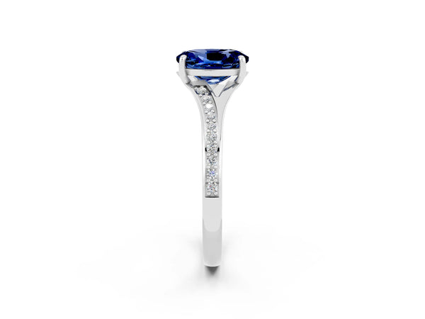 Silver Oval Cut Blue Sapphire Solitaire Ring with Pavé Band and Prong Setting