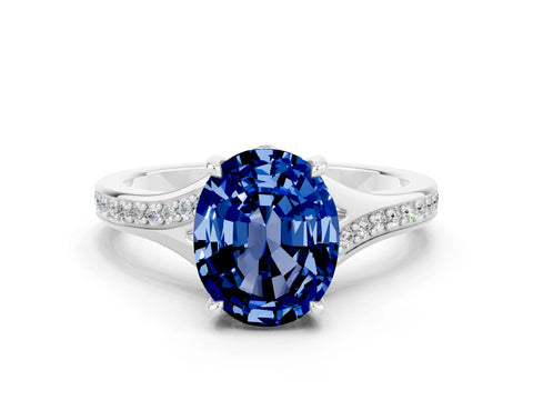 White gold Oval Cut Blue Sapphire Solitaire Ring with Pavé Band and Prong Setting