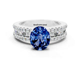 White gold Oval Cut Blue Sapphire Solitaire Ring with Pavé and Channel Set Band