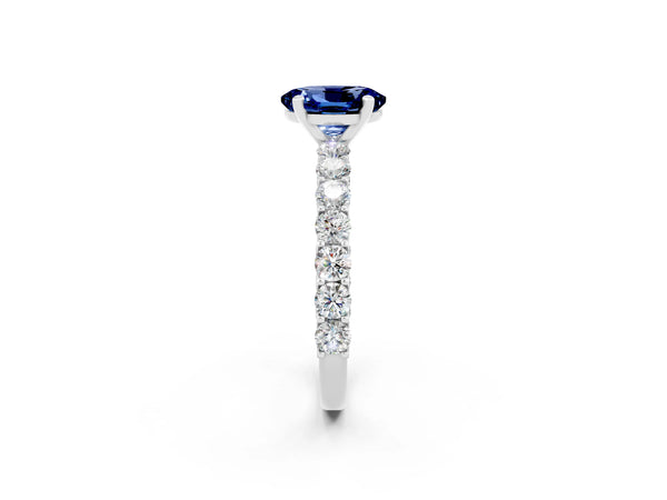 White gold Oval Cut Blue Sapphire Solitaire Ring with Shared Prong Pavé Band and Four-Prong Setting