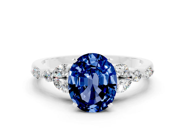 Platinum Oval Cut Blue Sapphire Solitaire Ring with Side Stones and Four-Prong Setting