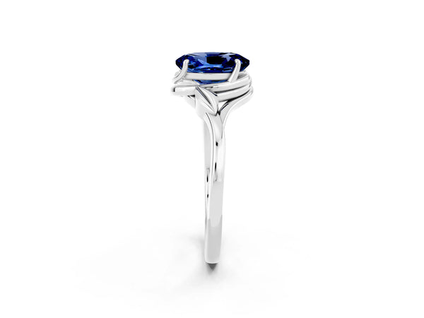 Platinum Oval Cut Blue Sapphire Solitaire Ring with Twist Band and Four-Prong Setting