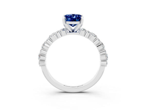 White gold Oval Cut Blue Sapphire Side Stone Solitaire Ring with Round  and Four-Prong Setting