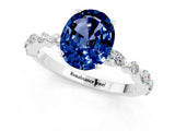White gold Oval Cut Blue Sapphire Solitaire with Side Stones on a Pavé Band and Four-Prong Setting_1