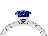 White gold Oval Cut Blue Sapphire Solitaire with Side Stones on a Pavé Band and Four-Prong Setting_4