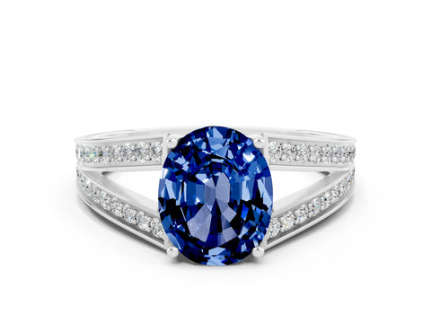 White gold Oval Cut Blue Sapphire Split Shank Ring with Pavé Band and Four-Prong Setting